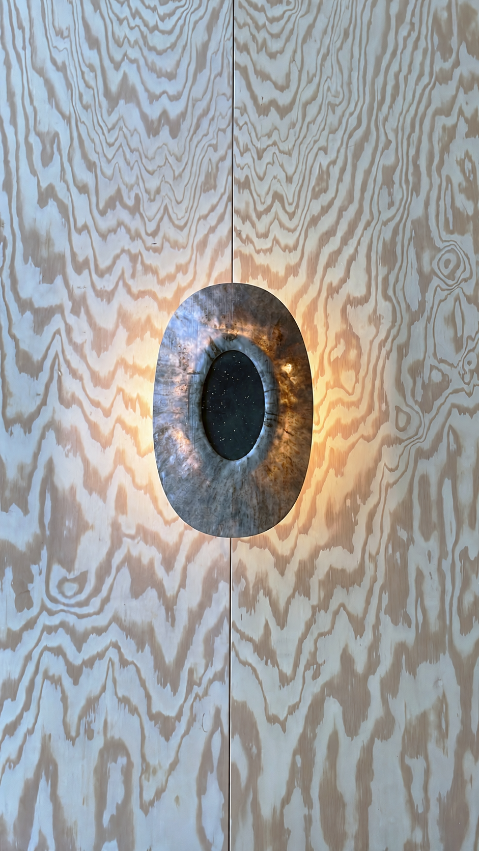 The Barnacle Lamp mounted on a wall